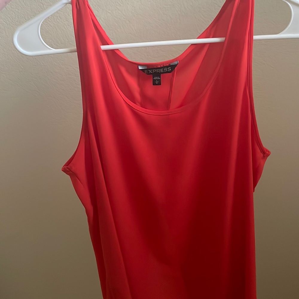 Express Orange top! Fun for a night out, style with leather pants or jeans